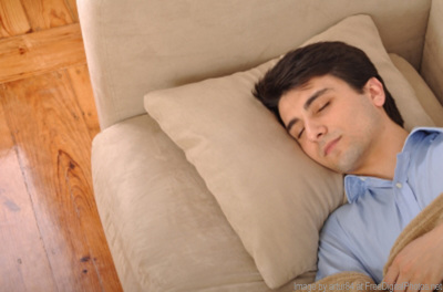 man napping on couch